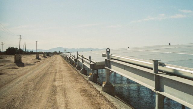 picture of solar panels over a canal