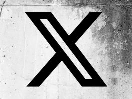 X (formerly Twitter) logo on a cracked wall