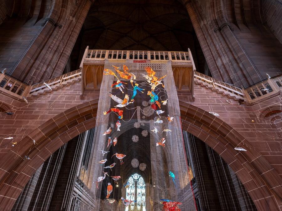 Weaving in a cathedral hanging from buttress