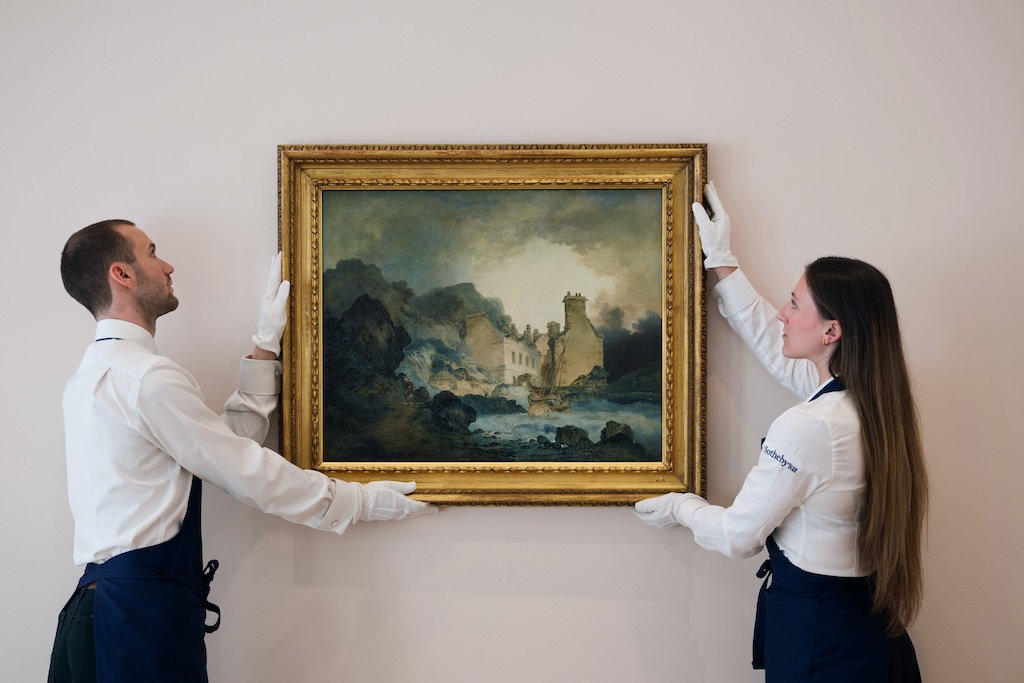 Early-JMW-Turner-Oil-Painting-to-Sell-for-300000.jpg Two white gloved art handlers hold a rediscovered landscape by J.M.W. Turner.