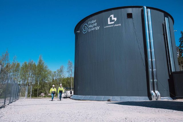Finland-warms-up-the-worlds-largest-sand-battery-and-the.jpeg Two technicians walk by the Pornainen sand battery.