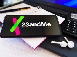 The 23andMe logo displayed on a smartphone screen.