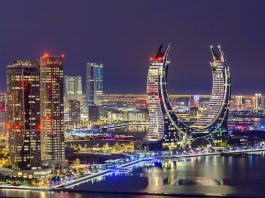 The general view of the ultra-luxury hotels Raffles and Fairmont in Doha, Qatar, on December 21, 2024. The dual-branded property is located within the iconic Katara Towers, a unique crescent-shaped building gracing the skyline of Lusail (Photo by Noushad Thekkayil/NurPhoto via Getty Images).