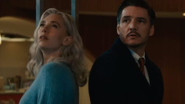 Its-a-family-affair-in-final-Fantastic-Four-First-Steps.jpg blond woman in a blue top and dark haired man in jacket and dress shirt staring up at the night sky