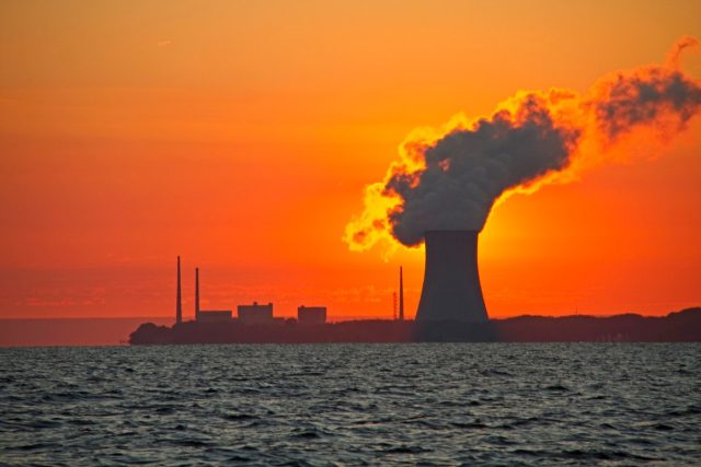 New-York-State-wants-more-nuclear-power-in-a-big.jpeg The sun rises behind a nuclear power plant cooling tower.