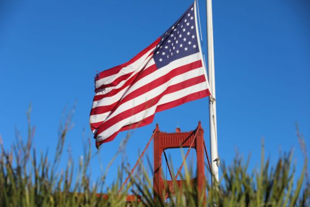 Silicon-Valley-tech-execs-are-joining-the-US-Army-Reserve.jpg An American flag near the Golden Gate Bridge in San Francisco, California.