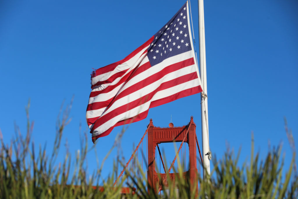 Silicon-Valley-tech-execs-are-joining-the-US-Army-Reserve.jpg An American flag near the Golden Gate Bridge in San Francisco, California.