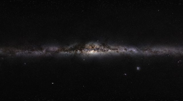 Simulations-find-ghostly-whirls-of-dark-matter-trailing-galaxy-arms.jpeg Edge-on view of a dusty galaxy.
