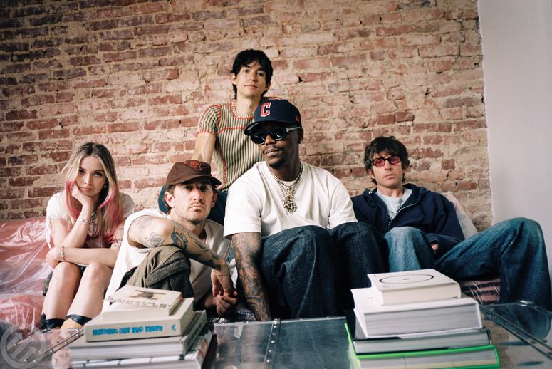 Image may contain: Lupe Fiasco, Howard Stern, Liam Aiken, People, Person, Clothing, Pants, Teen, Accessories, and Glasses