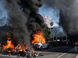Waymo cars burn during immigration raid protests on June 08, 2025 in Los Angeles, California. Tensions in the city remain high after the Trump administration called in the National Guard against the wishes of city leaders following two days of clashes with police during a series of immigration raids.