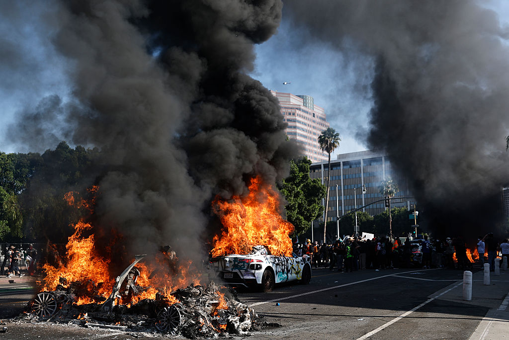 Waymo-robotaxis-Lime-e-scooters-set-ablaze-during-LA-protests.jpg Waymo cars burn during immigration raid protests on June 08, 2025 in Los Angeles, California. Tensions in the city remain high after the Trump administration called in the National Guard against the wishes of city leaders following two days of clashes with police during a series of immigration raids.