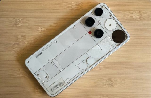 1751988363_Nothing-Phone-3-review-TechCrunch.jpg Nothing Phone 3 on a wooden board