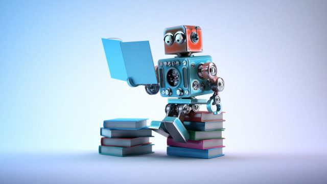 1752539823_New-Grok-AI-model-surprises-experts-by-checking-Elon-Musks.jpg Robot sitting on a bunch of books, reading a book.