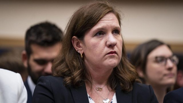 Court-rules-Trump-broke-US-law-when-he-fired-Democratic.jpg FTC Commissioner Rebecca Kelly Slaughter sits at a table during a Congressional committee hearing.