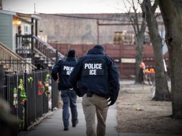 US Immigration and Customs Enforcement (ICE) agents walk down a street during a multi-agency targeted enforcement operation in Chicago, Illinois, US, on Sunday, Jan. 26, 2025.