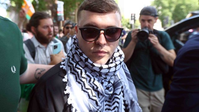 Kneecaps-Mo-Chara-Granted-Bail-in-First-Court-Appearance-on.jpg Kneecap’s Mo Chara Granted Bail in First Court Appearance on Terror Charge
