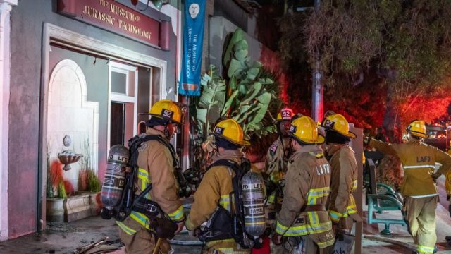 LAs-Museum-of-Jurassic-Technology-damaged-by-fire.jpg firefights standing outside museum building at night in Los angeles.