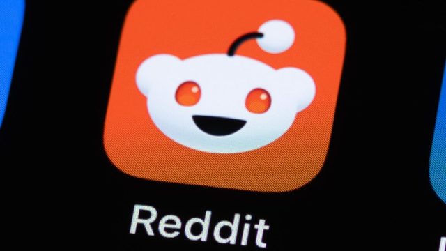 Reddits-UK-users-must-now-prove-theyre-18-to-view.jpg A Reddit app icon on a phone screen.