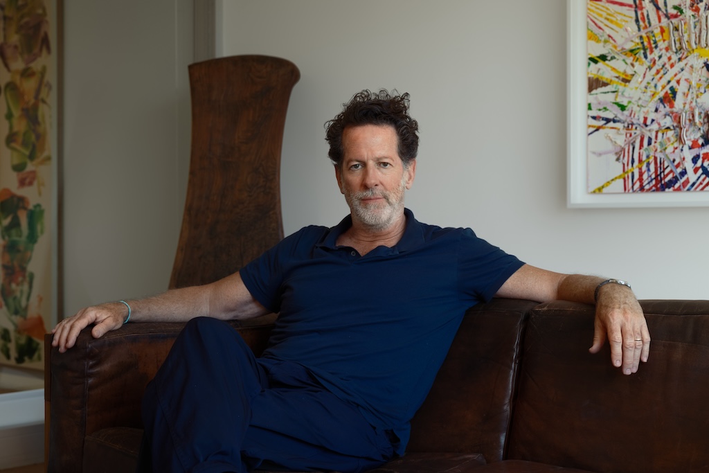 Tim-Blum-to-Sunset-Gallery-Seek-New-Model.jpg Portrait of a man with curly hair and a salt and pepper beard.
