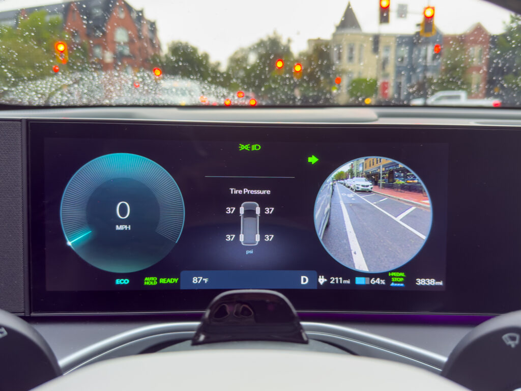 A Hyundai Ioniq 9 main instrument display showing the rear view blind spot camera when you use a turn signal